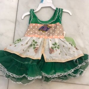 Baby dress with green ruffles